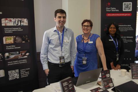 James Costabile, Cheri Violi and Danni Wijesiriwardana of Safe Work Australia’s Data Improvement and Analysis team at their booth at the Safe Work Australia Research Summit in September.